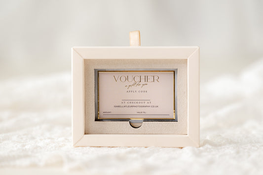 Gift voucher in a decorative box on a soft white background