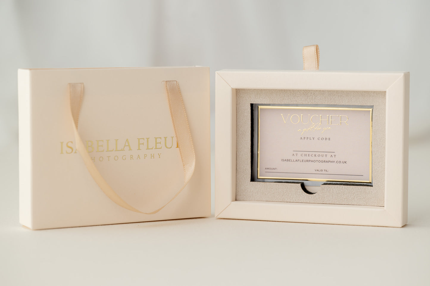 Cream-colored gift voucher and packaging with 'Isabelle Fleur' branding on a light gray background