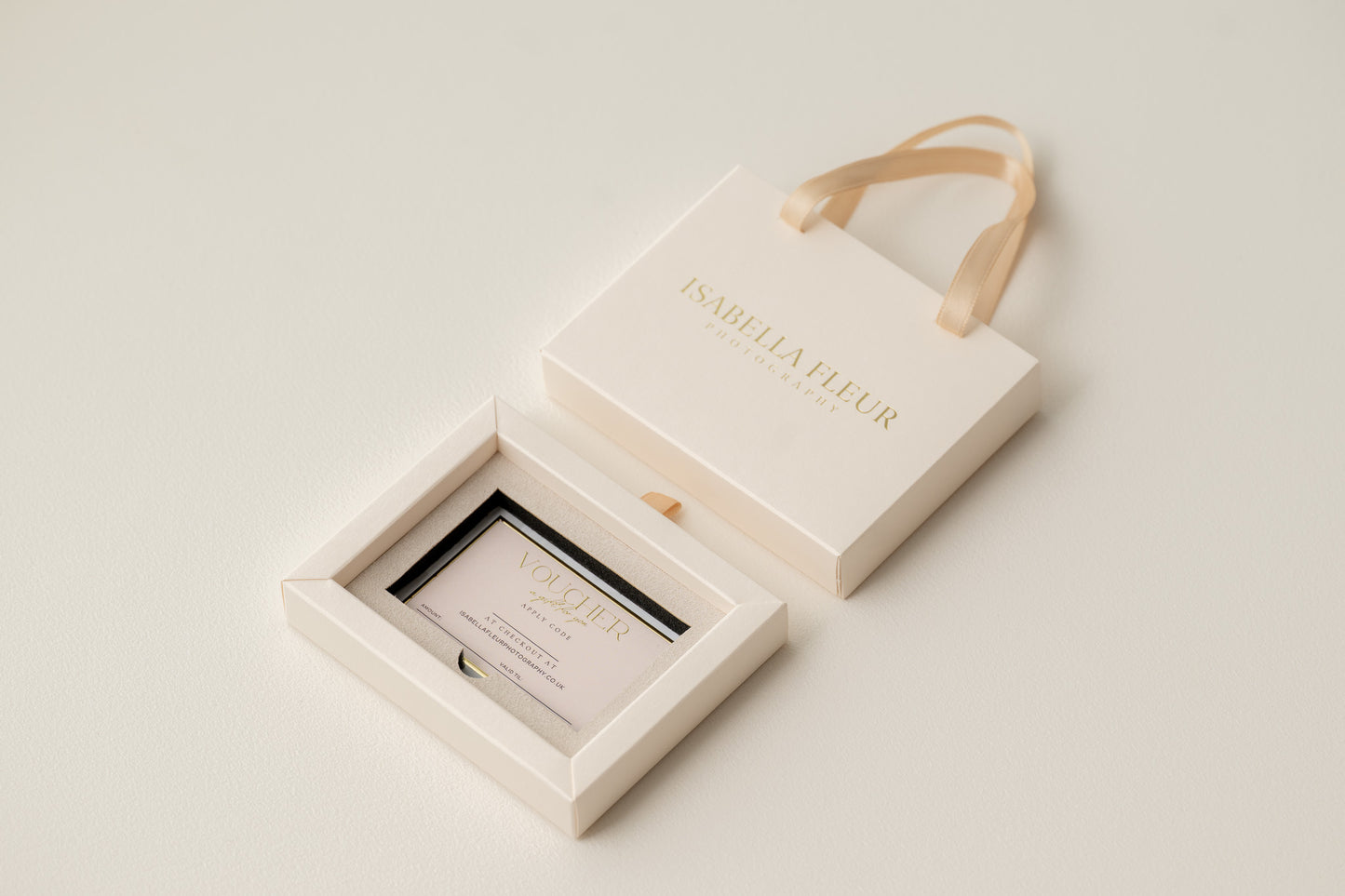 Gift voucher in a decorative box on a textured white surface