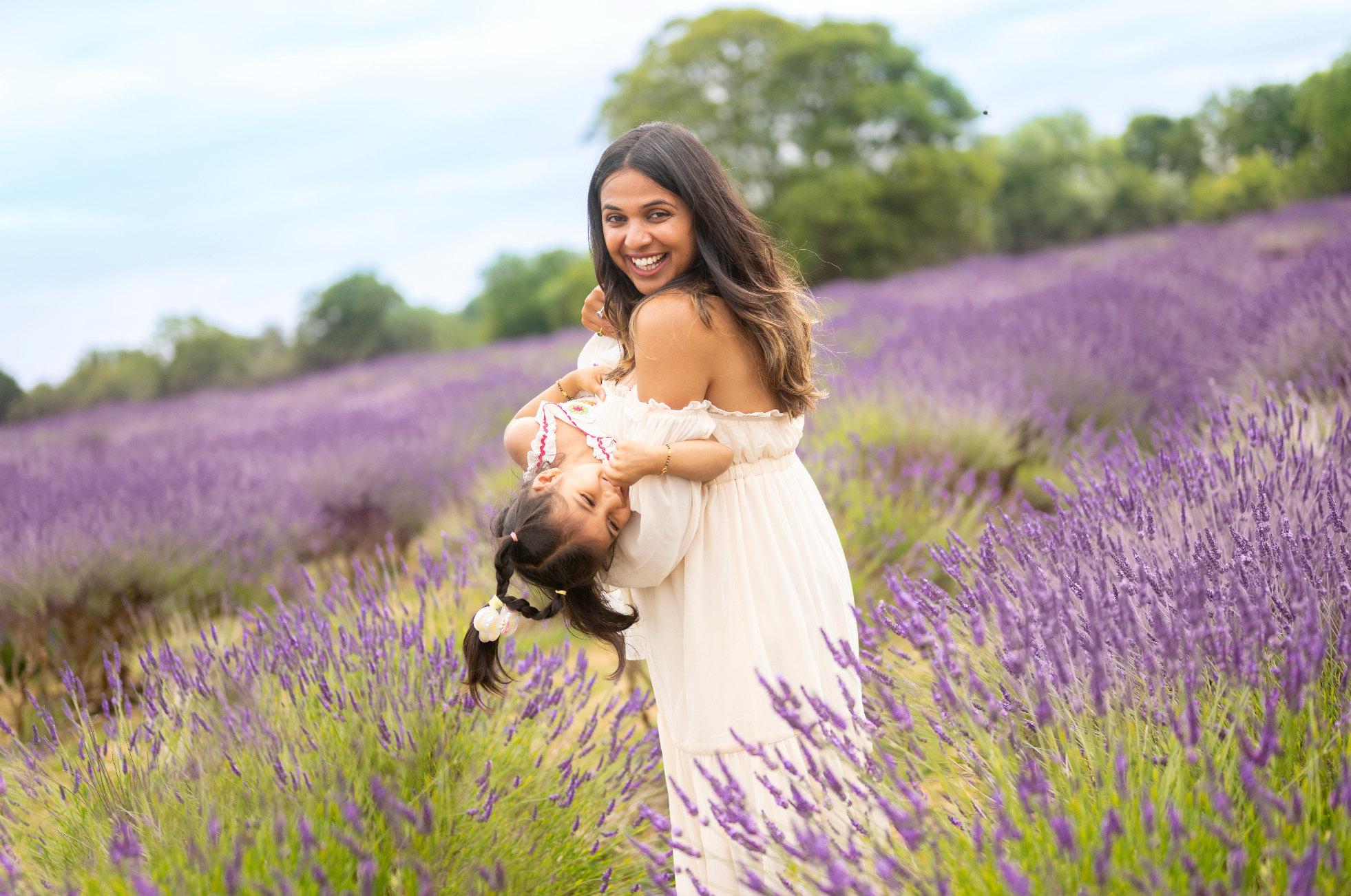 Woman holding a child in a lavender field photoshoot in Surrey