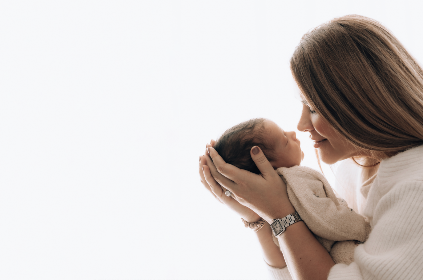 woman holding newborn baby 